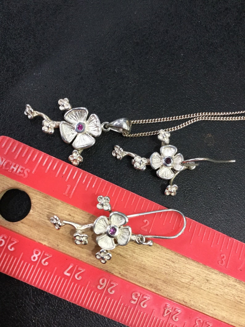 Silver ruby earrings and pendant