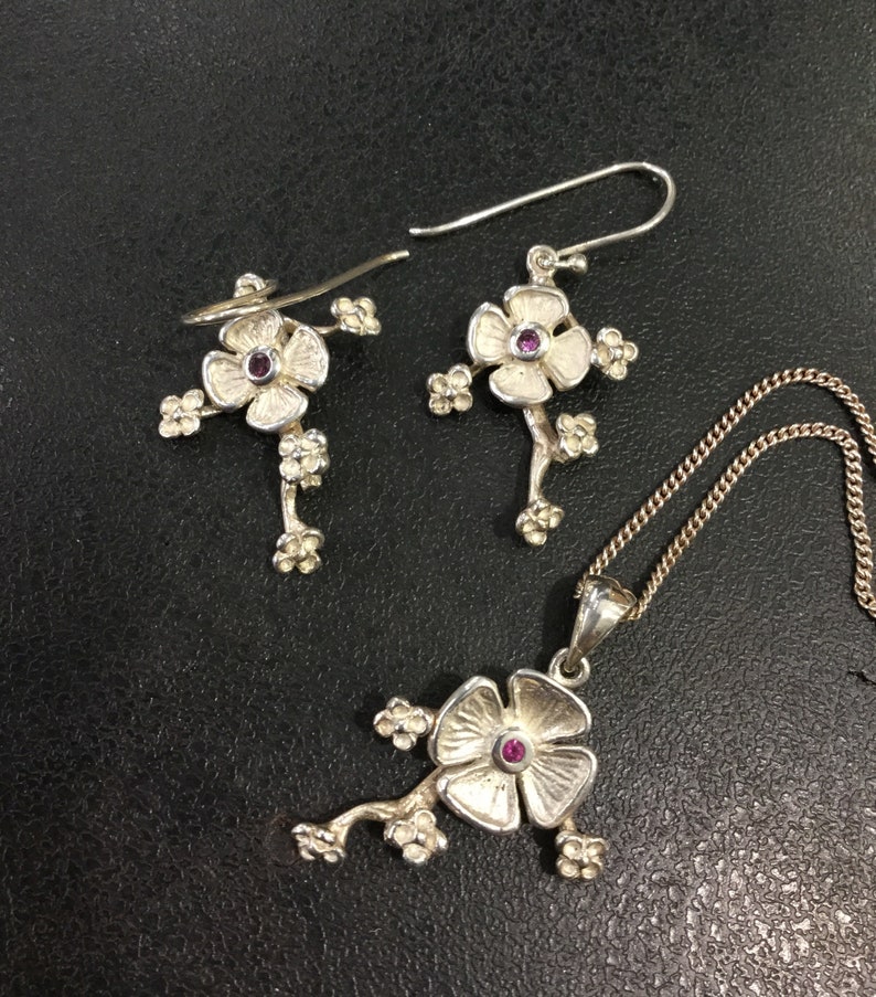 Silver ruby earrings and pendant