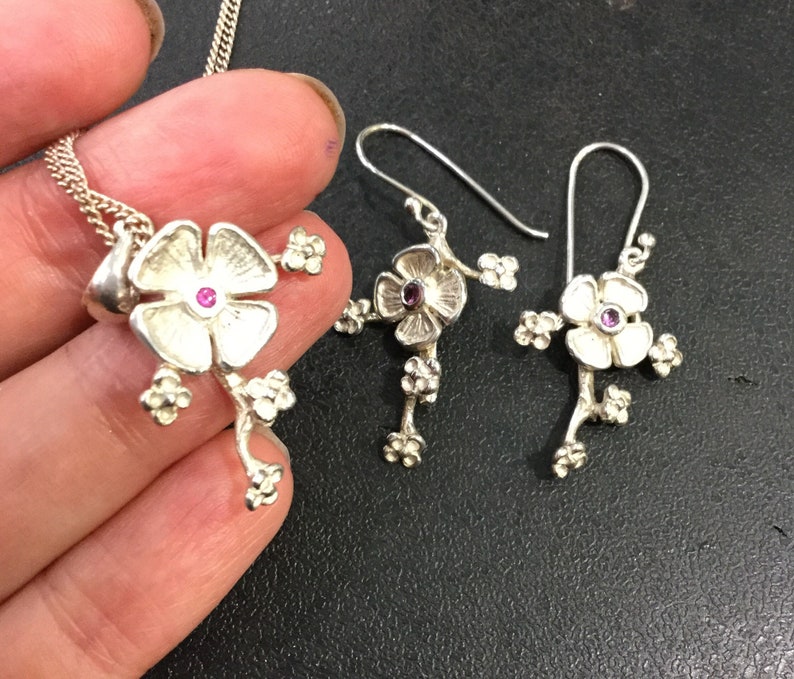 Silver ruby earrings and pendant
