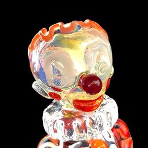 Hand blown glass clown pipe.