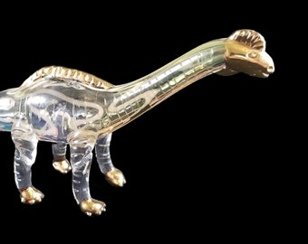 Hand blown glass dinosaur pipe.