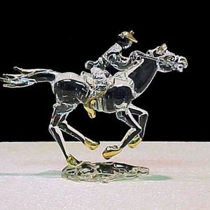 Hand blown glass race horse.