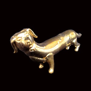 Blown glass golden dachshund pipe.