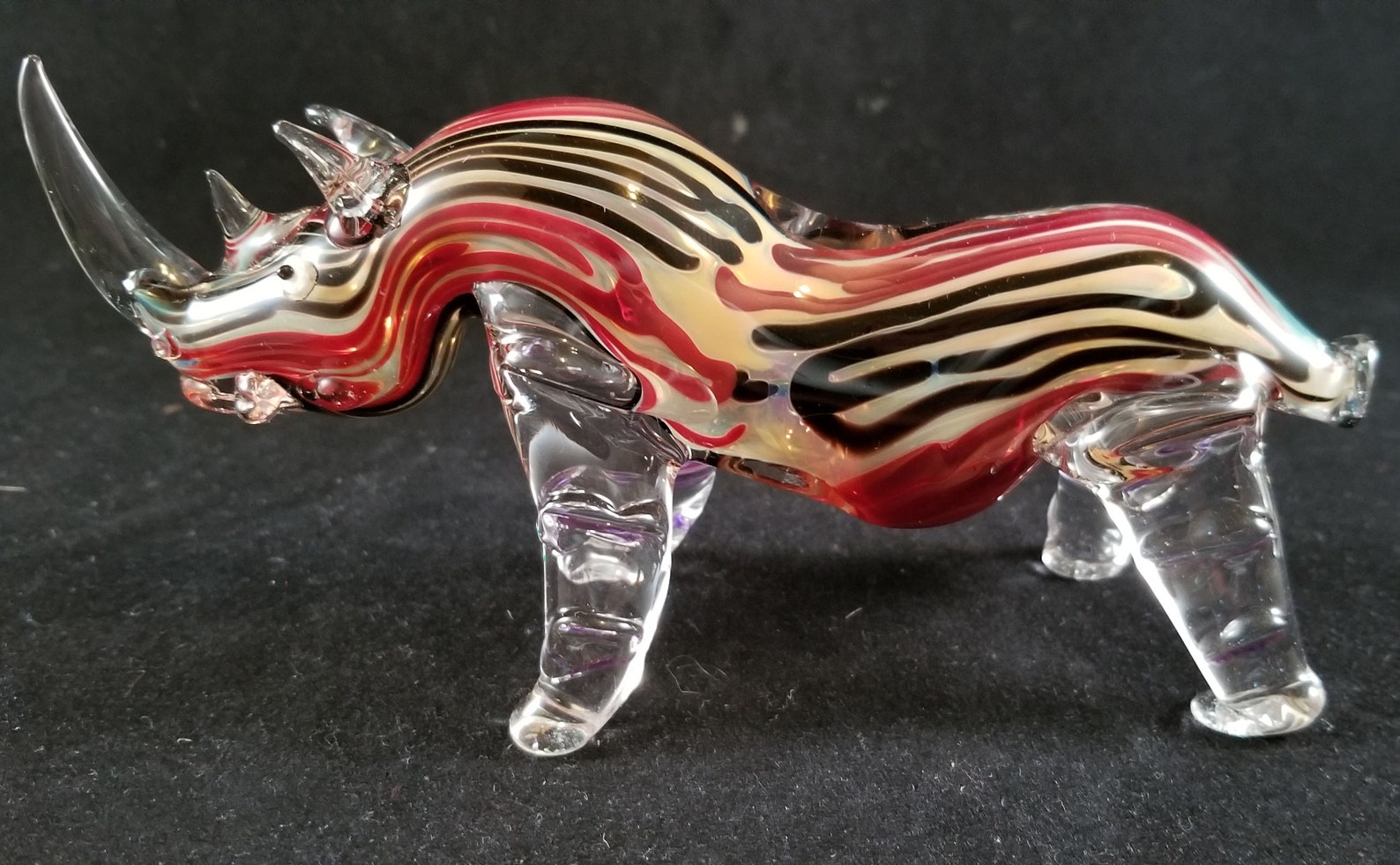 Hand blown glass rhinoceros pipe. Etsy
