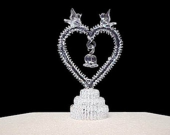 Small spun glass heart wedding cake topper.