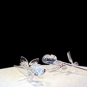 Hand blown glass long stem rose.