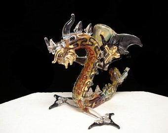 Hand blown glass dragon pipe with a standing ready to attack Dragon.