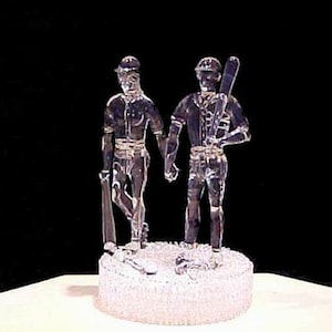 Baseball players wedding cake top.