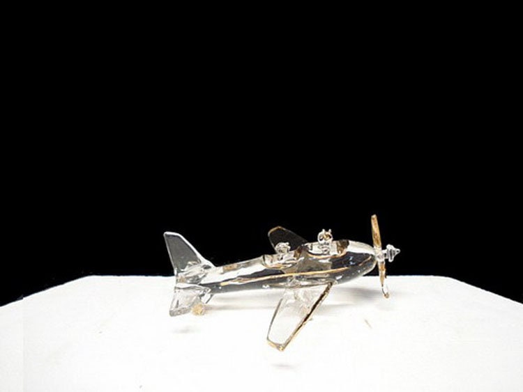 Plane wedding cake topper with the bride and groom.