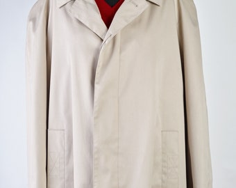 May include: A beige trench coat with a long length and a classic design. The coat has two pockets on the front and a button closure.
