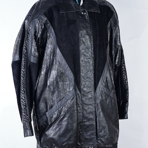 90s oversized black leather jacket with snake leather pattern and batwing cut sleeves. Size: EU 42