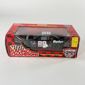 May include: A black die-cast stock car replica in a red and black box. The car has the number 88 and the name "Ryder" on the side. The box reads "Racing Champions" and "50th Anniversary".