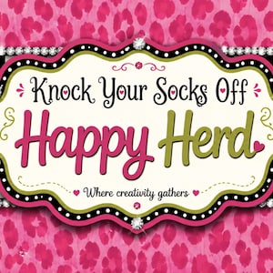 May include: A rectangular sign featuring a pink leopard print background with a central scalloped label. The label displays the text Knock Your Socks Off Happy Herd and Where creativity gathers, accented by rhinestones and a black and white checkerboard border.