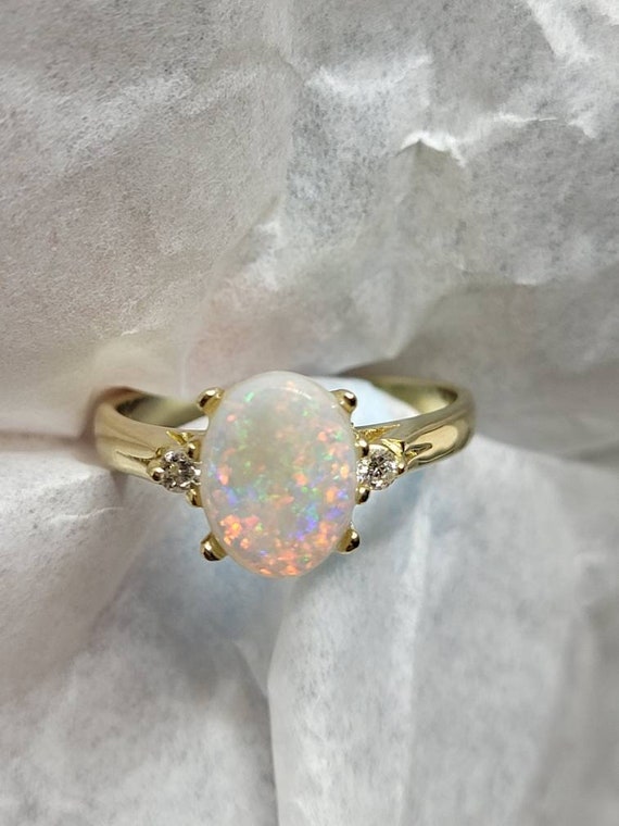 Estate jewelry opal and diamond ring.