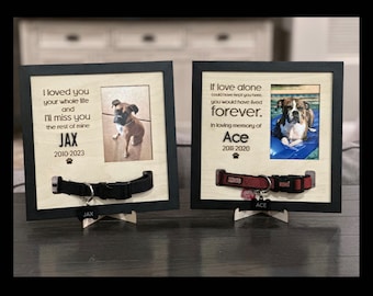 May include: Two wooden pet memorial frames with black frames. The frames have a photo of a dog in each, a collar, and a name tag. The text on the left frame reads "I loved you your whole life and I'll miss you the rest of mine JAX 2010-2023". The text on the right frame reads "If love alone could have kept you here you would have lived forever. In loving memory of Ace 2011-2020".