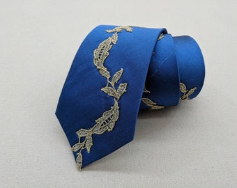 Hand made blue silk tie with gold lace applique design.