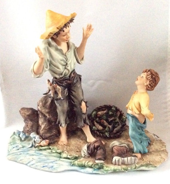 boy fishing figurine