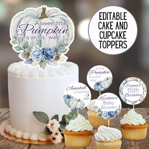 Puede incluir: Una tarta blanca con una decoración en forma de calabaza y el texto "A sweet little Pumpkin is on his way!". Cupcakes con adornos que dicen "Annabell is turning 2" y "Kristine's Baby Shower".