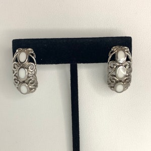 Vintage Trifari TM Earrings Curved Silver Tone Swirled Open Work Bezel Set White Settings