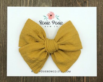 mustard baby bow