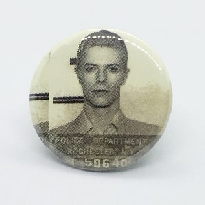 David Bowie Mugshot - 1 1/4&quot; Pin, Zipper Pull, Keychain or Magnet
