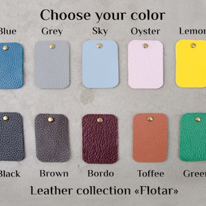 May include: Leather swatches in various colors, including blue, grey, sky blue, oyster, lemon, black, brown, bordo, toffee, and green. The text "Choose your color" and "Leather collection &laquo;Flotar&raquo;" is displayed below the swatches.