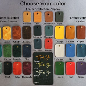 May include: A chart of leather colors and names for a leather goods company. The chart includes leather types "Nappa", "Crazy Horse", and "Kaiser".