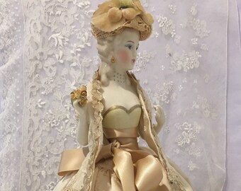 Reproduction half doll "Juliette" as pincushion dressed in cream brocade and lace with flowered hat