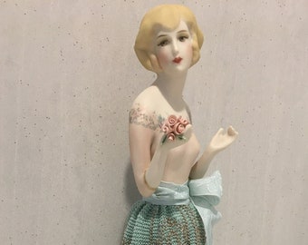 Reproduction Half doll "Adelaide" painted in pink with decals and carrying hand made porcelain flowers