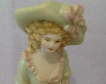 Antique reproduction half doll "Lillian" 7 cms tall painted in green with pink trim