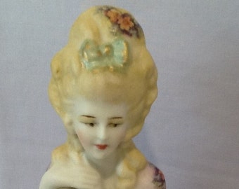 Antique reproduction half doll "Kirsten" 10 cms tall painted in pink with green and gold trim and decals