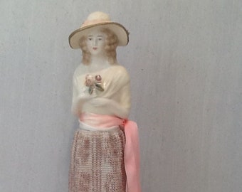 Lovely reproduction ceramic half doll "Aimie"  12cms tall with long beaded skirt knitted in beige cotton with gold beads.