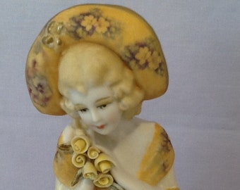 Antique reproduction half doll "Zara" painted in deep gold with decals.  She has mid yellow coloured hand made porcelain roses.