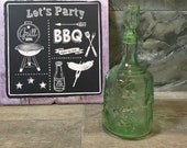 Green vintage glass decanter with stopper, soviet table decor