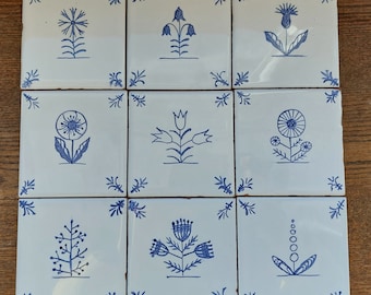 Set of nine hand painted Delft style blue ceramic tiles with wild flower design. Dutch blue. Backsplash tile. Kitchen, bathroom decor