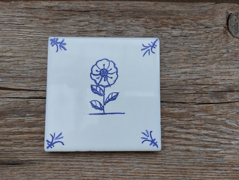 Hand painted Delft style blue ceramic tile with wild flower design. Dutch blue. Backsplash tile. Kitchen, bathroom decor, wall art Marigold