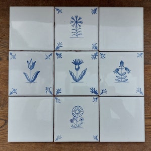 4 Hand painted Delft style blue ceramic tiles with wild flower design and 4 corner tiles.