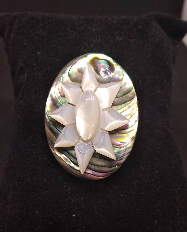 Old abalone brooch and mother pearl