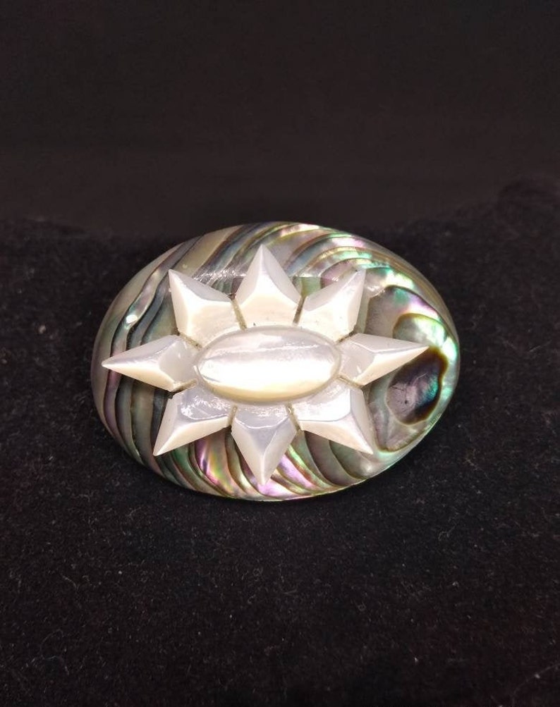 Old abalone brooch and mother pearl