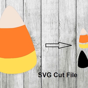 May include: SVG cut file design of a candy corn with orange, yellow, and white layers. The design is shown on a woodgrain background.