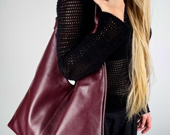 Leather hobo bag featuring pebbled texture and soft shoulder strap