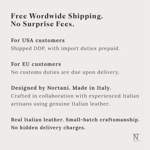 May include: A light grey informational graphic featuring black text that reads: Designed by Nortani. Made in Italy. Crafted in collaboration with experienced Italian artisans using genuine Italian leather. Real Italian leather. Small-batch craftsmanship.