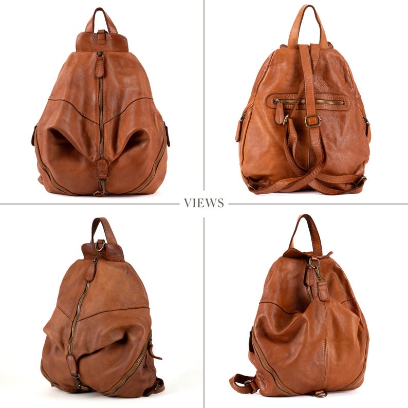 May include: A tan leather backpack featuring a teardrop shape, a top handle, and multiple zippered compartments. The front displays a vertical central zipper, while the back shows adjustable shoulder straps and a horizontal zippered pocket.