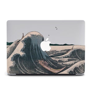 May include: A laptop skin with a graphic of a large wave crashing over a boat. The wave is blue and white, and the boat is red and white. The skin is designed to fit a MacBook.