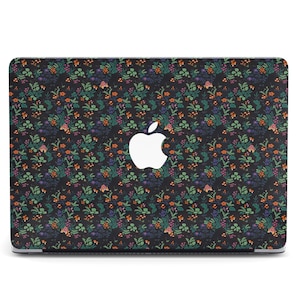 May include: A black laptop skin with a floral pattern in shades of orange, green, and blue. The Apple logo is visible in the center of the skin.