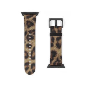 Könnte beinhalten: Schwarzes und braunes Apple Watch Armband mit Leopardenmuster und schwarzer Schließe.