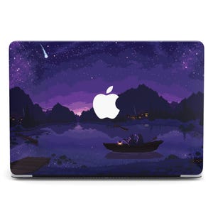 May include: Laptop case featuring a pixelated night scene with a lake, mountains, and a starry sky. A boat with a person is on the water. The Apple logo is visible. The color palette includes shades of purple, blue, and black.