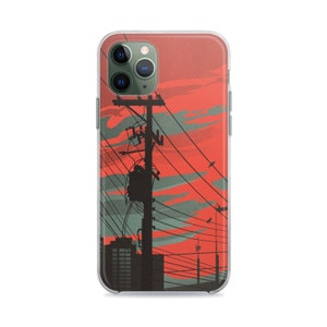 Puede incluir: Una funda transparente para teléfono con un gráfico de una línea eléctrica en silueta contra un cielo de puesta de sol rojo y gris.
