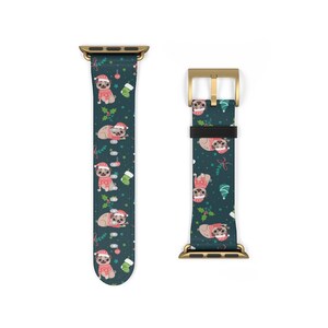 May include: A gold and black Apple Watch band with a Christmas pug pattern. The band has a dark green background with pugs wearing red and white sweaters, holly, and ornaments.