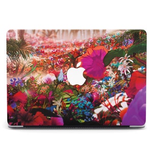 May include: A colorful laptop skin with a floral design featuring pink, red, purple, and green flowers. The Apple logo is visible in the center of the skin.